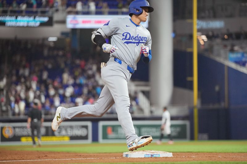 Sep 17, 2024; Miami, Florida, USA;  Los Angeles Dodgers designated hitter Shohei Ohtani (17) rounds the bases after hitting a two-run home run in the third inning against the Miami Marlins at loanDepot Park. Mandatory Credit: Jim Rassol-Imagn Images