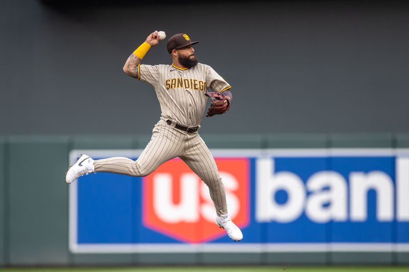 May 10, 2023; Minneapolis, Minnesota, USA; San Diego Padres second baseman Rougned Odor (24) jumps up and throws the ball to first base for an out after fielding a ground ball in the first inning against the Minnesota Twins at Target Field. Mandatory Credit: Jesse Johnson-USA TODAY Sports