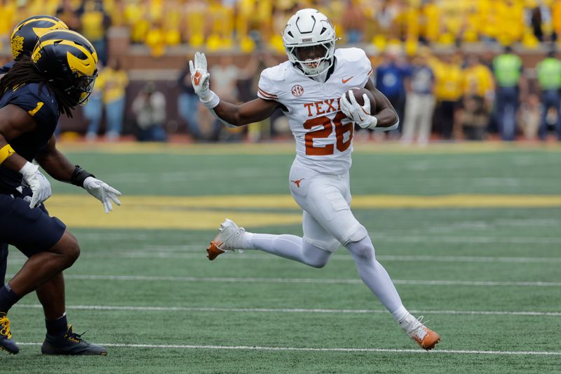 Sep 7, 2024; Ann Arbor, Michigan, USA; Texas Longhorns running back Quintrevion Wisner (26) rushes in the first half against the Michigan Wolverines at Michigan Stadium. Mandatory Credit: Rick Osentoski-Imagn Images