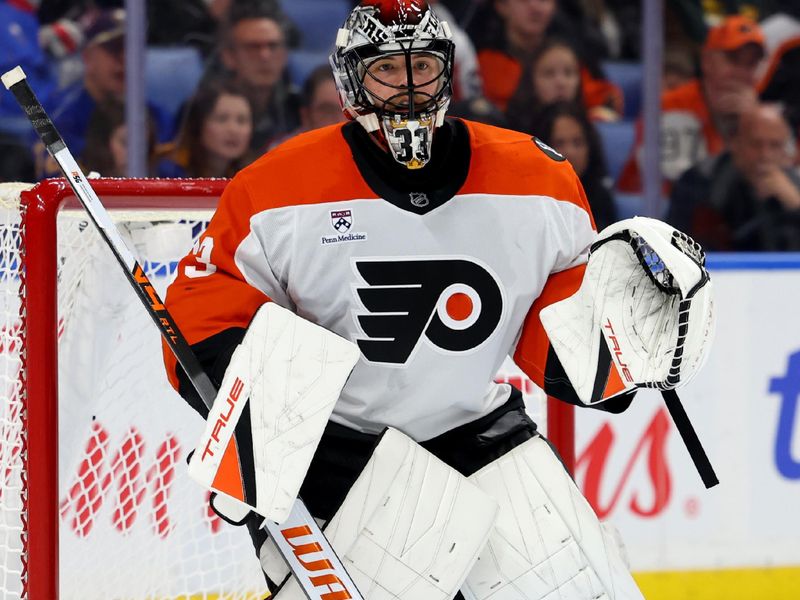 Dec 18, 2025; Buffalo, New York, USA;  Philadelphia Flyers goaltender Samuel Ersson (33) looks for the puck during the second period against the Buffalo Sabres at KeyBank Center. Mandatory Credit: Timothy T. Ludwig-Imagn Images