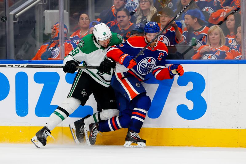 May 25, 2025; Edmonton, Alberta, CAN; Dallas Stars defenseman Alexander Petrovic (28) checks Edmonton Oilers center Connor McDavid (97) during the third period in game three of the Western Conference Final of the 2025 Stanley Cup Playoffs at Rogers Place. Mandatory Credit: Perry Nelson-Imagn Images