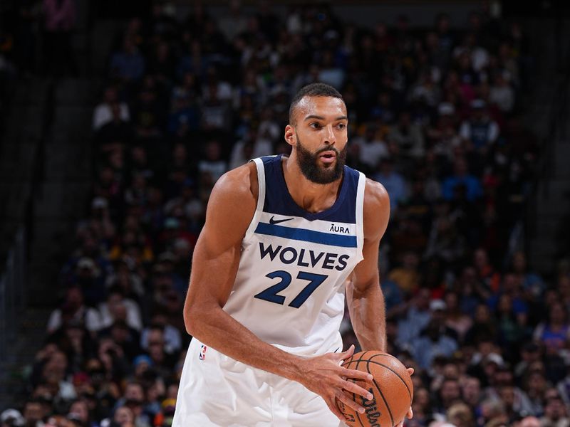 DENVER, CO - APRIL 10: Rudy Gobert #27 of the Minnesota Timberwolves looks to pass the ball during the game against the Denver Nuggets on April 10, 2024 at the Ball Arena in Denver, Colorado. NOTE TO USER: User expressly acknowledges and agrees that, by downloading and/or using this Photograph, user is consenting to the terms and conditions of the Getty Images License Agreement. Mandatory Copyright Notice: Copyright 2024 NBAE (Photo by Garrett Ellwood/NBAE via Getty Images)