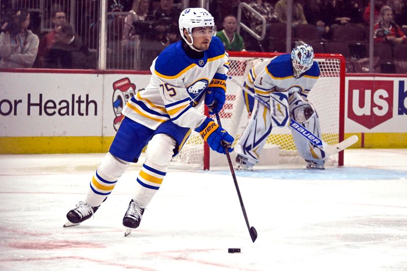 Oct 19, 2024; Chicago, Illinois, USA;  Buffalo Sabres defenseman Connor Clifton (75) moves the puck against the Chicago Blackhawks during the first period at the United Center. Mandatory Credit: Matt Marton-Imagn Images