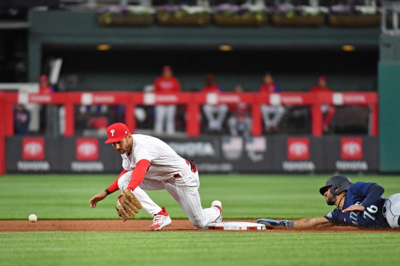 Apr 25, 2023; Philadelphia, Pennsylvania, USA; Seattle Mariners shortstop Jose Caballero (76) is safe at second base on an error as throw gets past Philadelphia Phillies shortstop Trea Turner (7) during the fifth inning at Citizens Bank Park. Mandatory Credit: Eric Hartline-USA TODAY Sports