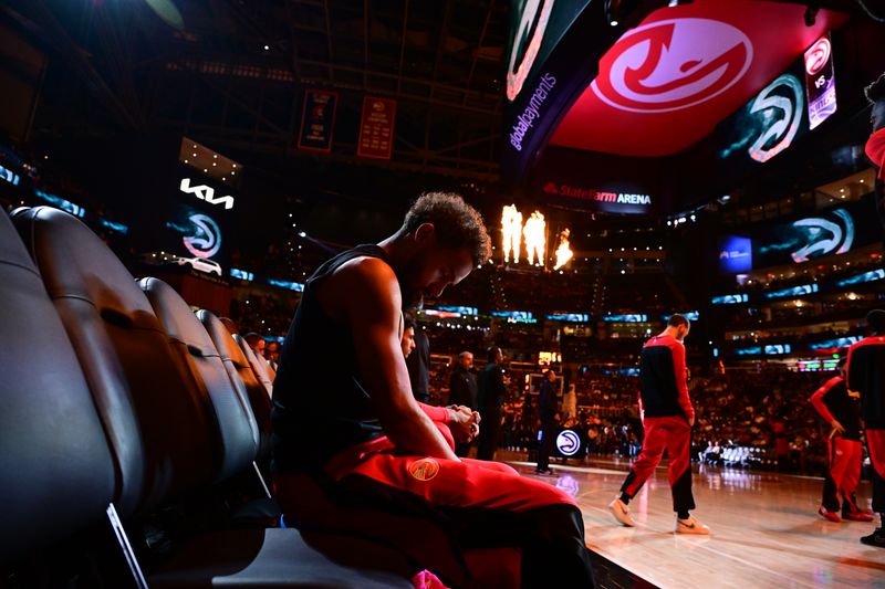 ATLANTA, GA - NOVEMBER 1: Trae Young #11 of the Atlanta Hawks closes his eyes before the game against the Sacramento Kings on November 1, 2024 at State Farm Arena in Atlanta, Georgia.  NOTE TO USER: User expressly acknowledges and agrees that, by downloading and/or using this Photograph, user is consenting to the terms and conditions of the Getty Images License Agreement. Mandatory Copyright Notice: Copyright 2024 NBAE (Photo by Adam Hagy/NBAE via Getty Images)