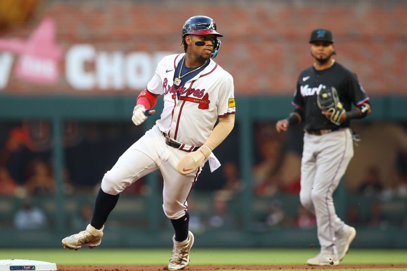 Apr 24, 2024; Atlanta, Georgia, USA; Atlanta Braves right fielder Ronald Acuna Jr. (13) steals second base against the Miami Marlins in the first inning at Truist Park. Mandatory Credit: Brett Davis-USA TODAY Sports
