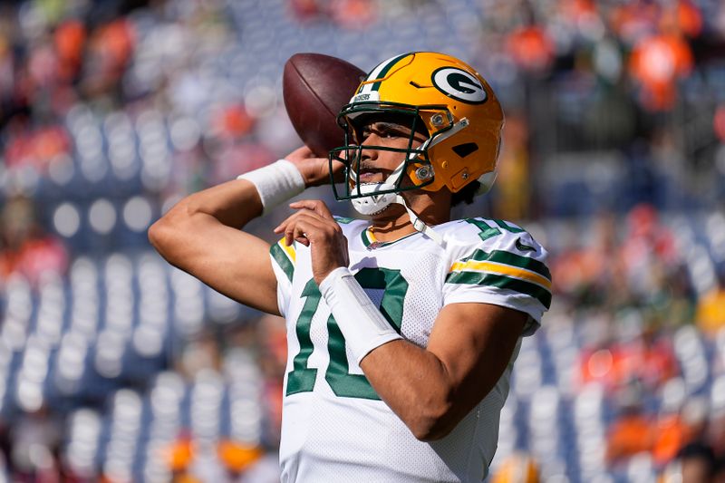 Green Bay Packers quarterback Jordan Love (10) warms up before an NFL football game against the Denver Broncos in Denver, Sunday, Oct. 22, 2023. (AP Photo/Jack Dempsey)