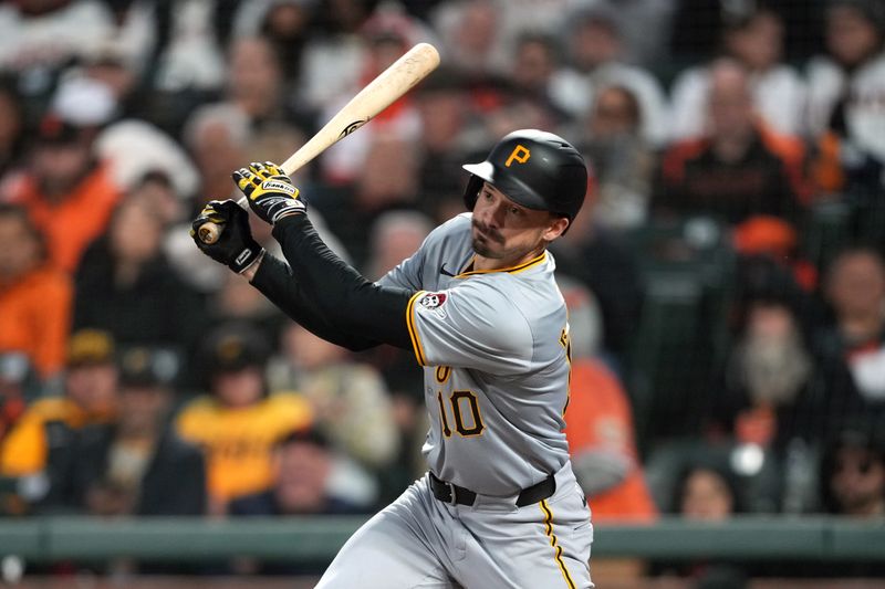 Apr 27, 2024; San Francisco, California, USA; Pittsburgh Pirates left fielder Bryan Reynolds (10) hits a single against the San Francisco Giants during the eighth inning at Oracle Park. Mandatory Credit: Darren Yamashita-USA TODAY Sports