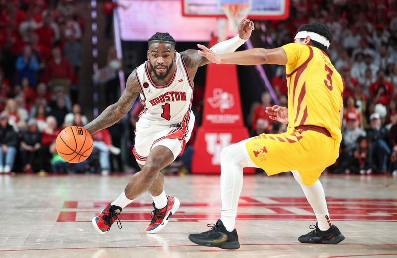 Feb 19, 2024; Houston, Texas, USA; Houston Cougars guard Jamal Shead (1) drives with the ball as Iowa State Cyclones guard Tamin Lipsey (3) defends during the second half at Fertitta Center. Mandatory Credit: Troy Taormina-USA TODAY Sports