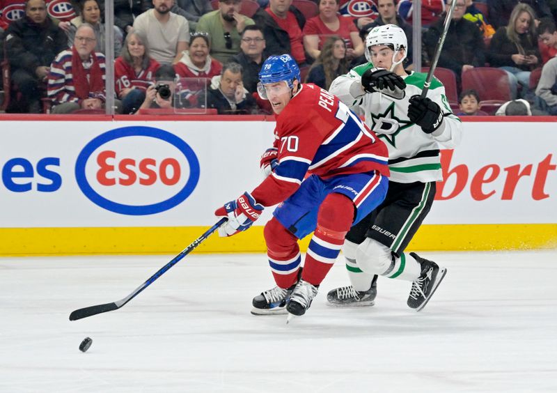 Feb 10, 2024; Montreal, Quebec, CAN; Montreal Canadiens forward Tanner Pearson (70) controls the puck against Dallas Stars forward Mason Marchment (27) defends during the first period at the Bell Centre. Mandatory Credit: Eric Bolte-USA TODAY Sports