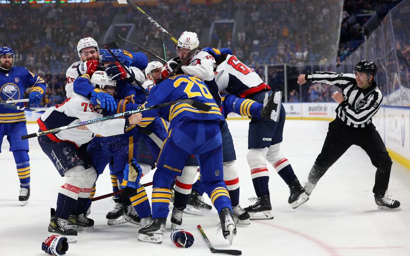 Apr 11, 2024; Buffalo, New York, USA;  Buffalo Sabres and Washington Capitals players get in to a scrum at the end of the third period during a game at KeyBank Center. Mandatory Credit: Timothy T. Ludwig-USA TODAY Sports