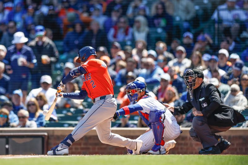 Apr 25, 2024; Chicago, Illinois, USA; Houston Astros third baseman Alex Bregman (2) singles against the Chicago Cubs during the first inning at Wrigley Field. Mandatory Credit: Kamil Krzaczynski-USA TODAY Sports