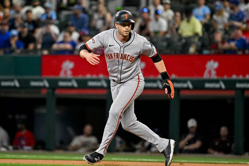 Jun 8, 2024; Arlington, Texas, USA; San Francisco Giants right fielder Austin Slater (13( checks the play during the first inning against the Texas Rangers at Globe Life Field. Mandatory Credit: Jerome Miron-USA TODAY Sports