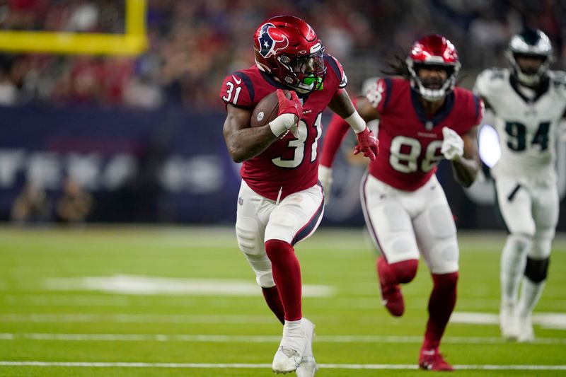 Houston Texans running back Dameon Pierce (31) runs the ball during an NFL football game against the Philadelphia Eagles in Houston, Thursday, Nov. 3, 2022. (AP Photo/Tony Gutierrez)