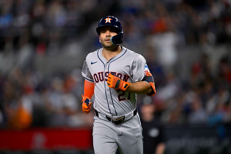 Aug 5, 2024; Arlington, Texas, USA; Houston Astros second baseman Jose Altuve (27) runs off the field during the third inning against the Texas Rangers at Globe Life Field. Mandatory Credit: Jerome Miron-USA TODAY Sports