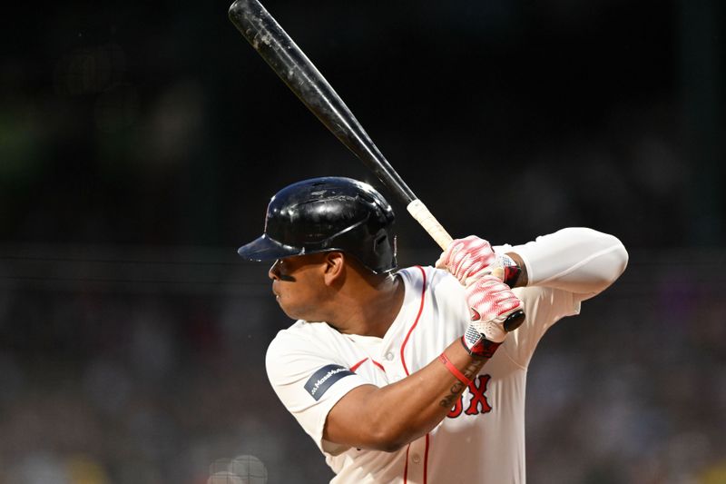 Apr 28, 2024; Boston, Massachusetts, USA; Boston Red Sox third baseman Rafael Devers (11) bats against the Chicago Cubs during the first inning at Fenway Park. Mandatory Credit: Brian Fluharty-USA TODAY Sports