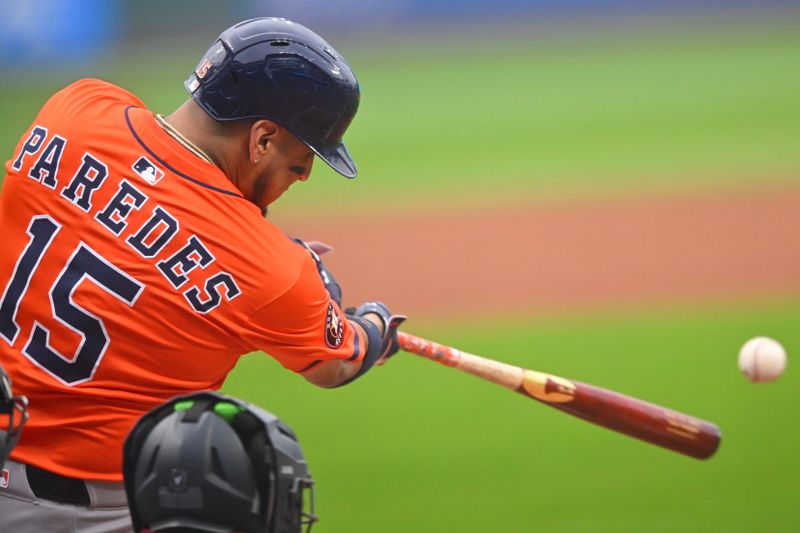 Jun 6, 2025; Cleveland, Ohio, USA; Houston Astros third baseman Isaac Paredes (15) singles in the third inning against the Cleveland Guardians at Progressive Field. Mandatory Credit: David Richard-Imagn Images