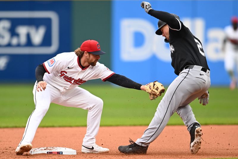 Apr 10, 2025; Cleveland, Ohio, USA; Cleveland Guardians second baseman Daniel Schneemann (10) tags out Chicago White Sox catcher Matt Thaiss (29) during the first inning at Progressive Field. Mandatory Credit: Ken Blaze-Imagn Images