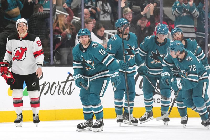 Jan 4, 2025; San Jose, California, USA; San Jose Sharks right wing Nikolai Kovalenko (15) reacts after scoring a goal against the New Jersey Devils during the first period at SAP Center at San Jose. Mandatory Credit: Darren Yamashita-Imagn Images