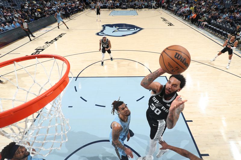 MEMPHIS, TN - APRIL 9: Julian Champagnie #30 of the San Antonio Spurs drives to the basket during the game against the Memphis Grizzlies on April 9, 2024 at FedExForum in Memphis, Tennessee. NOTE TO USER: User expressly acknowledges and agrees that, by downloading and or using this photograph, User is consenting to the terms and conditions of the Getty Images License Agreement. Mandatory Copyright Notice: Copyright 2024 NBAE (Photo by Joe Murphy/NBAE via Getty Images)