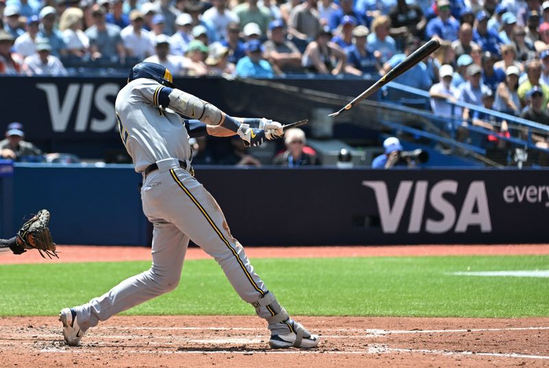 Jun 1, 2023; Toronto, Ontario, CAN;  Milwaukee Brewers designated hitter Christian Yelich (22) breaks his bat as he grounds out against the Toronto Blue Jays in the fifth inning at Rogers Centre. Mandatory Credit: Dan Hamilton-USA TODAY Sports