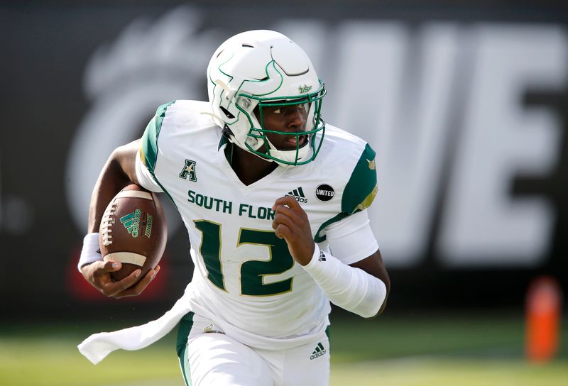 Oct 3, 2020; Cincinnati, OH, USA; South Florida Bulls quarterback Katravis Marsh (12) runs during the second quarter against the Cincinnati Bearcats at Nippert Stadium. Mandatory Credit: Joseph Maiorana-USA TODAY Sports