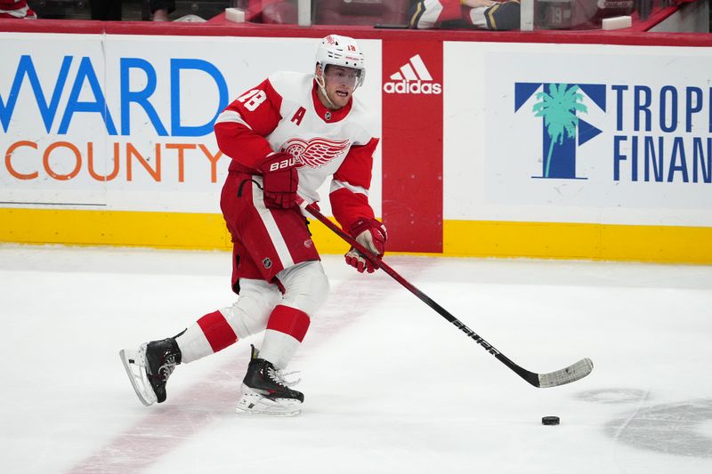 Jan 17, 2024; Sunrise, Florida, USA; Detroit Red Wings center Andrew Copp (18) skates with the puck against the Florida Panthers during the third period at Amerant Bank Arena. Mandatory Credit: Jasen Vinlove-USA TODAY Sports