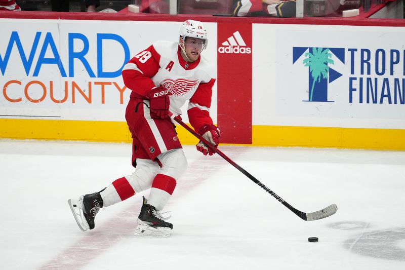 Jan 17, 2024; Sunrise, Florida, USA; Detroit Red Wings center Andrew Copp (18) skates with the puck against the Florida Panthers during the third period at Amerant Bank Arena. Mandatory Credit: Jasen Vinlove-USA TODAY Sports