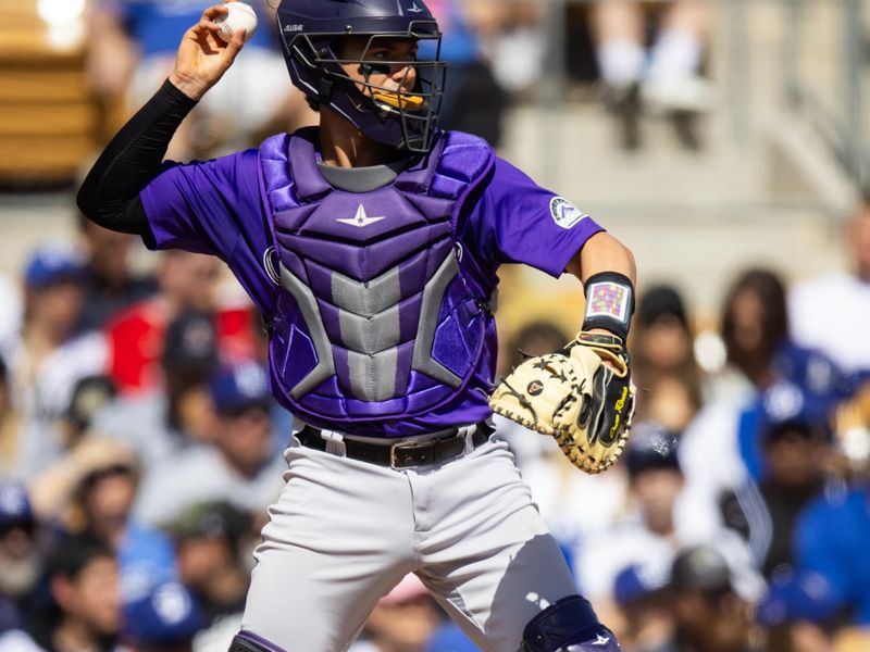 Mar 3, 2024; Phoenix, Arizona, USA; Colorado Rockies catcher Drew Romo against the Los Angeles Dodgers during a spring training game at Camelback Ranch-Glendale. Mandatory Credit: Mark J. Rebilas-USA TODAY Sports