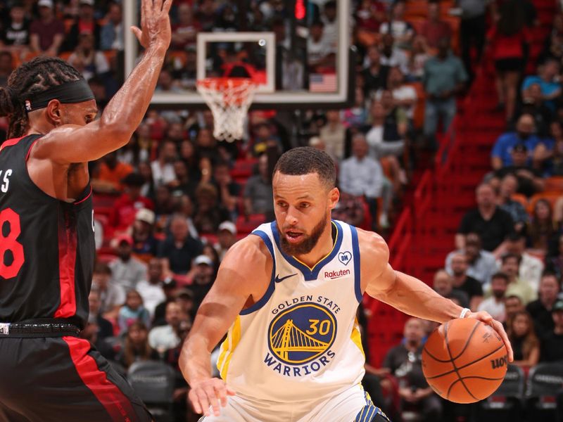 MIAMI, FL - MARCH 26:  Stephen Curry #30 of the Golden State Warriors dribbles the ball during the game against the Miami Heat on March 26, 2024 at Kaseya Center in Miami, Florida. NOTE TO USER: User expressly acknowledges and agrees that, by downloading and or using this Photograph, user is consenting to the terms and conditions of the Getty Images License Agreement. Mandatory Copyright Notice: Copyright 2024 NBAE (Photo by Issac Baldizon/NBAE via Getty Images)