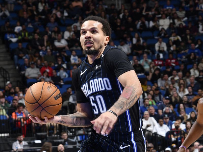 ORLANDO, FL - JANUARY 5 :  Cole Anthony #50 of the Orlando Magic drives to the basket during the game against the Utah Jazz on January 5, 2025 at Kia Center in Orlando, Florida. NOTE TO USER: User expressly acknowledges and agrees that, by downloading and or using this photograph, User is consenting to the terms and conditions of the Getty Images License Agreement. Mandatory Copyright Notice: Copyright 2025 NBAE (Photo by Fernando Medina/NBAE via Getty Images)