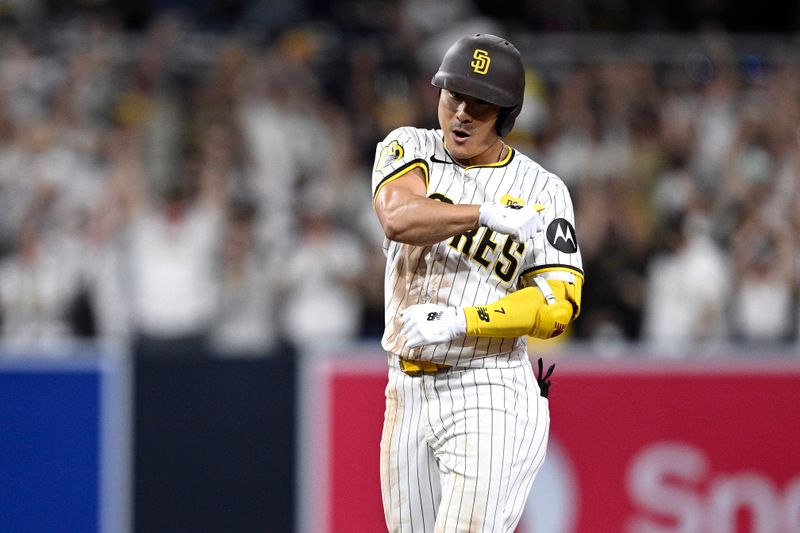 Jul 6, 2024; San Diego, California, USA; San Diego Padres shortstop Ha-Seong Kim (7) celebrates after hitting an RBI double against the Arizona Diamondbacks during the eighth inning at Petco Park. Mandatory Credit: Orlando Ramirez-USA TODAY Sports