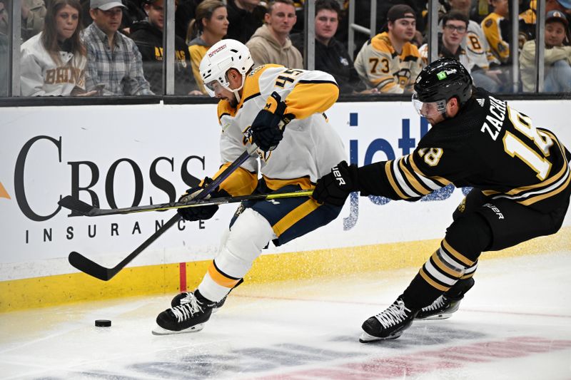 Oct 14, 2023; Boston, Massachusetts, USA; Boston Bruins center Pavel Zacha (18) defends Nashville Predators defenseman Alexandre Carrier (45) during the second period at the TD Garden. Mandatory Credit: Brian Fluharty-USA TODAY Sports