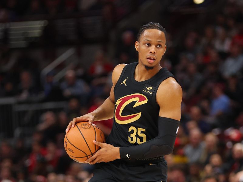 CHICAGO, ILLINOIS - DECEMBER 23: Isaac Okoro #35 of the Cleveland Cavaliers dribbles against the Chicago Bulls during the first half at the United Center on December 23, 2023 in Chicago, Illinois. NOTE TO USER: User expressly acknowledges and agrees that, by downloading and or using this photograph, User is consenting to the terms and conditions of the Getty Images License Agreement.  (Photo by Michael Reaves/Getty Images)