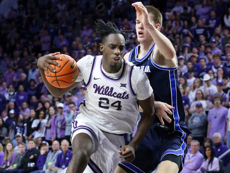 Feb 24, 2024; Manhattan, Kansas, USA; Kansas State Wildcats forward Arthur Maluma (24) drives to the basket against Brigham Young Cougars forward Noah Waterman (0) during the first half at Bramlage Coliseum. Mandatory Credit: Scott Sewell-USA TODAY Sports