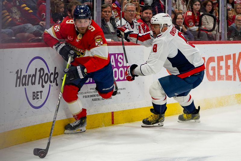 Dec 29, 2025; Sunrise, Florida, USA; Florida Panthers center Sam Bennett (9) battles for the puck against Washington Capitals left wing Alex Ovechkin (8) during the first period at Amerant Bank Arena. Mandatory Credit: Jeff Romance-Imagn Images