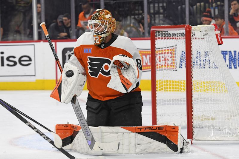 Mar 4, 2025; Philadelphia, Pennsylvania, USA; Philadelphia Flyers goaltender Ivan Fedotov (82) makes a save against the Calgary Flames during the second period at Wells Fargo Center. Mandatory Credit: Eric Hartline-Imagn Images