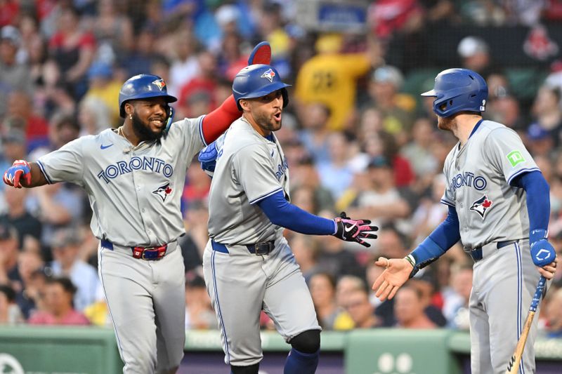 Jun 25, 2024; Boston, Massachusetts, USA; Toronto Blue Jays right fielder George Springer (4) high-fives catcher Danny Jansen (9) after hitting a two-run home run against the Boston Red Sox during the third inning at Fenway Park. Mandatory Credit: Brian Fluharty-USA TODAY Sports