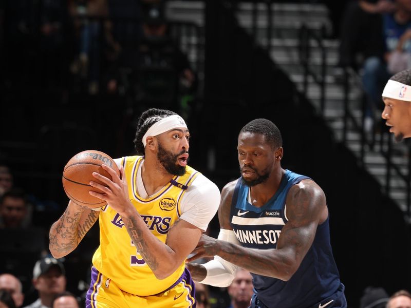 MINNEAPOLIS, MN -  DECEMBER 13:  Anthony Davis #3 of the Los Angeles Lakers handles the ball during the game against the Minnesota Timberwolves on December 13, 2024 at Target Center in Minneapolis, Minnesota. NOTE TO USER: User expressly acknowledges and agrees that, by downloading and or using this Photograph, user is consenting to the terms and conditions of the Getty Images License Agreement. Mandatory Copyright Notice: Copyright 2024 NBAE (Photo by David Sherman/NBAE via Getty Images)