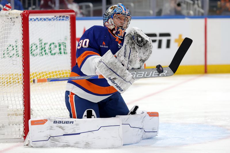 Jan 28, 2025; Elmont, New York, USA; New York Islanders goaltender Ilya Sorokin (30) makes a save against the Colorado Avalanche during the first period at UBS Arena. Mandatory Credit: Brad Penner-Imagn Images