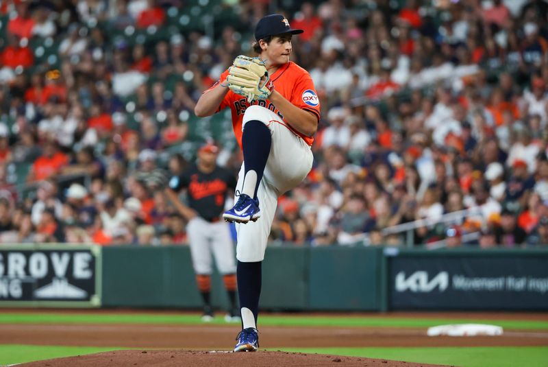 Jun 21, 2024; Houston, Texas, USA; Houston Astros starting pitcher Jake Bloss (39) pitches against the Baltimore Orioles in the first inning at Minute Maid Park. Mandatory Credit: Thomas Shea-USA TODAY Sports