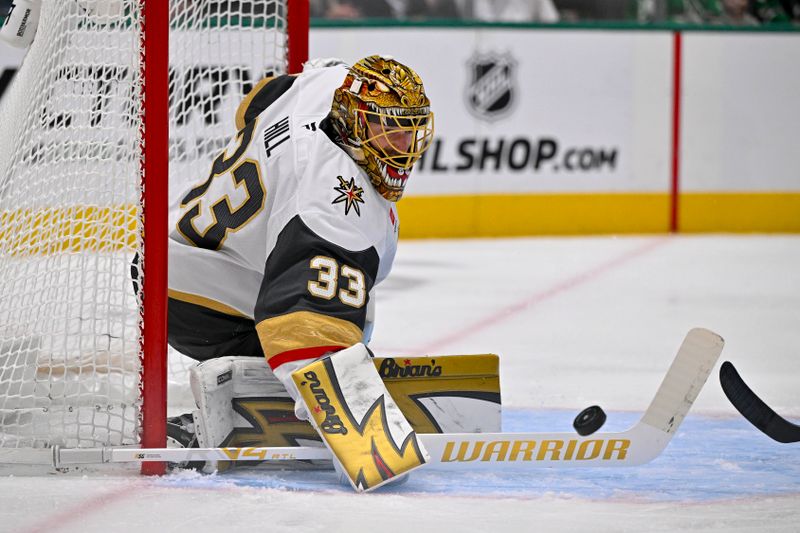 Mar 22, 2026; Dallas, Texas, USA; Vegas Golden Knights goaltender Adin Hill (33) makes a pad save on a Dallas Stars shot during the second period at the American Airlines Center. Mandatory Credit: Jerome Miron-Imagn Images
