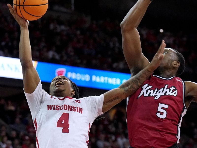 Feb. 18, 2023; Madison, WI, USA; Wisconsin Badgers guard Kamari McGee (4) shoots against Rutgers Scarlet Knights forward Aundre Hyatt (5) during the second half at the Kohl Center. Rutgers beat Wisconsin 58-57. Mandatory Credit: Mark Hoffman-USA TODAY Sports