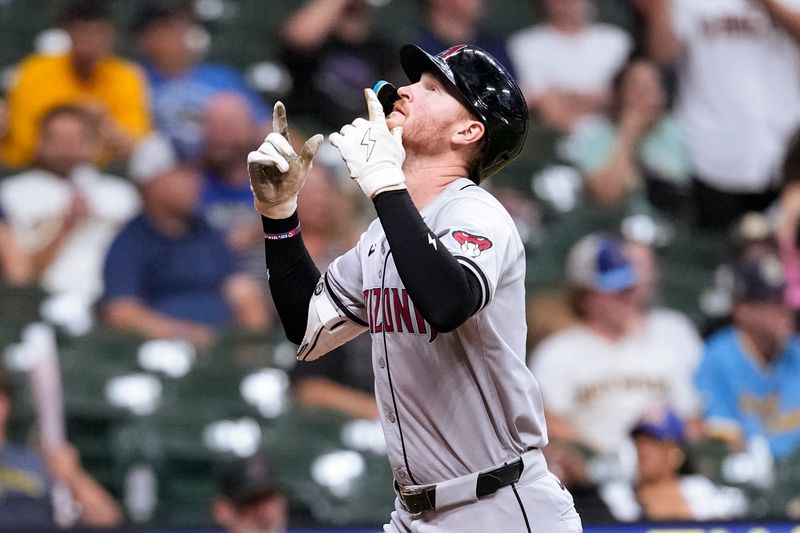 Sep 19, 2024; Milwaukee, Wisconsin, USA;  Arizona Diamondbacks left fielder Pavin Smith (26) celebrates after hitting a home run during the eighth inning against the Milwaukee Brewers at American Family Field. Mandatory Credit: Jeff Hanisch-Imagn Images