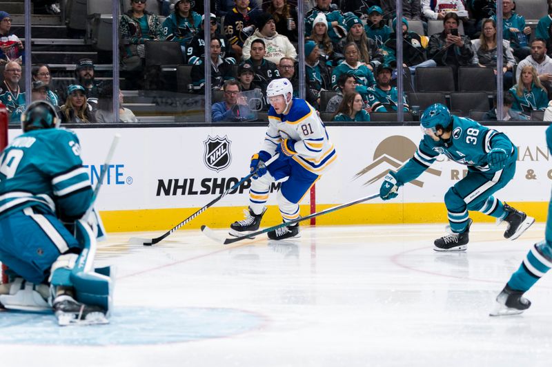 Nov 23, 2024; San Jose, California, USA; San Jose Sharks defenseman Mario Ferraro (38) defends Buffalo Sabres center Sam Lafferty (81) during the first period at SAP Center in San Jose. Mandatory Credit: John Hefti-Imagn Images