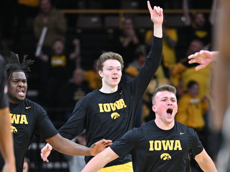 Feb 25, 2023; Iowa City, Iowa, USA; The Iowa Hawkeyes bench reacts at the end of regulation against the Michigan State Spartans at Carver-Hawkeye Arena. Mandatory Credit: Jeffrey Becker-USA TODAY Sports