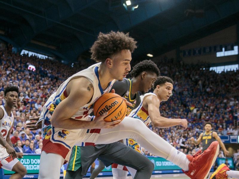 Feb 18, 2023; Lawrence, Kansas, USA; Kansas Jayhawks forward Jalen Wilson (10) grabs a rebound during the first half against the Baylor Bears at Allen Fieldhouse. Mandatory Credit: William Purnell-USA TODAY Sports