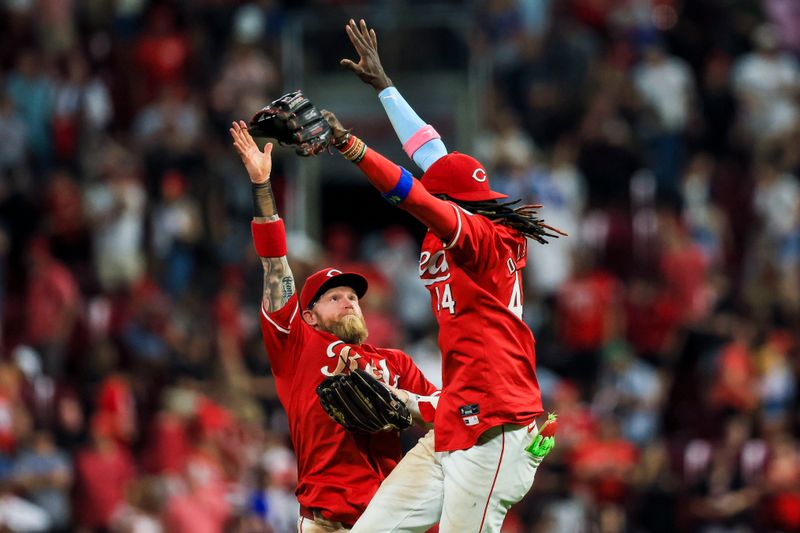 May 25, 2024; Cincinnati, Ohio, USA; Cincinnati Reds outfielder Jake Fraley (27) high fives shortstop Elly De La Cruz (44) after the victory over the Los Angeles Dodgers at Great American Ball Park. Mandatory Credit: Katie Stratman-USA TODAY Sports