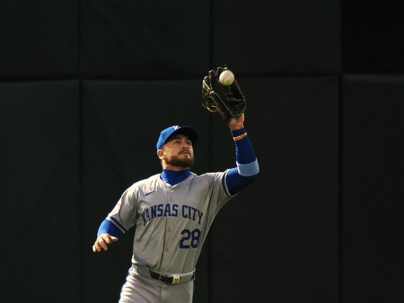 Jun 19, 2024; Oakland, California, USA; Kansas City Royals center fielder Kyle Isbel (28) catches the ball against the Oakland Athletics during the sixth inning at Oakland-Alameda County Coliseum. Mandatory Credit: Kelley L Cox-USA TODAY Sports