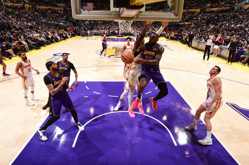 LOS ANGELES, CA - JANUARY 3:  LeBron James #23 of the Los Angeles Lakers handles the ball during the game against the Atlanta Hawks on January 3, 2025 at Crypto.Com Arena in Los Angeles, California. NOTE TO USER: User expressly acknowledges and agrees that, by downloading and/or using this Photograph, user is consenting to the terms and conditions of the Getty Images License Agreement. Mandatory Copyright Notice: Copyright 2025 NBAE (Photo by Adam Pantozzi/NBAE via Getty Images)